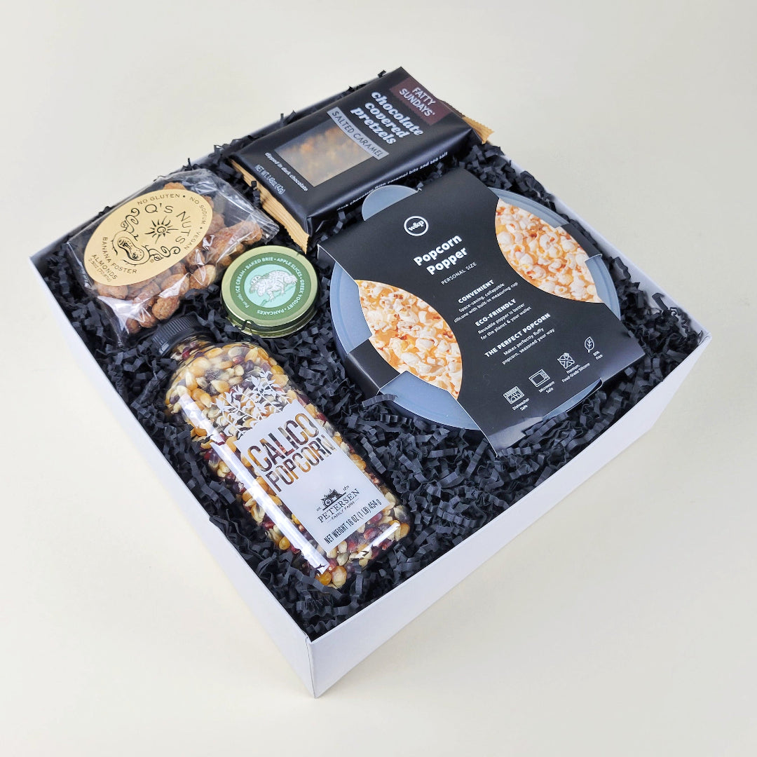 movie night gift with popcorn, popper, caramel, nuts, and pretzels